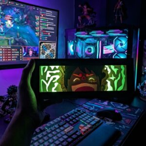 A rectangular black-framed 3D anime paper cut light box illuminated from within showing a multi-layered paper design of Luffy glowing in green and red light.